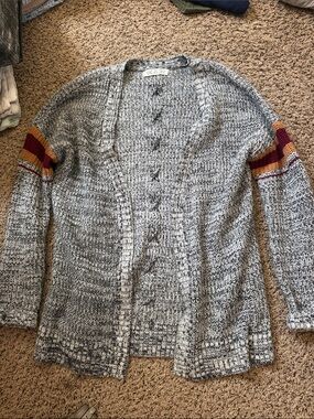 Grey, Black, and White Cardigan with Maroon and Orange strips.